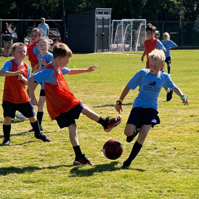 Students playing soccer